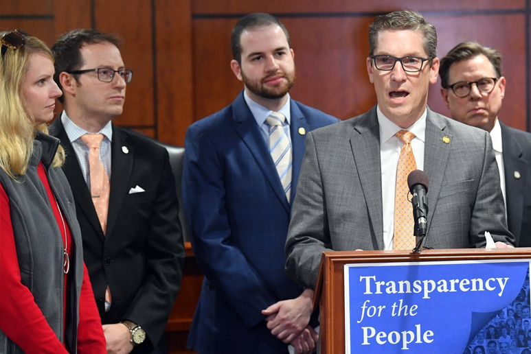 Bipartisan transparency legislation passage Mark Huizenga Jeremy Moss